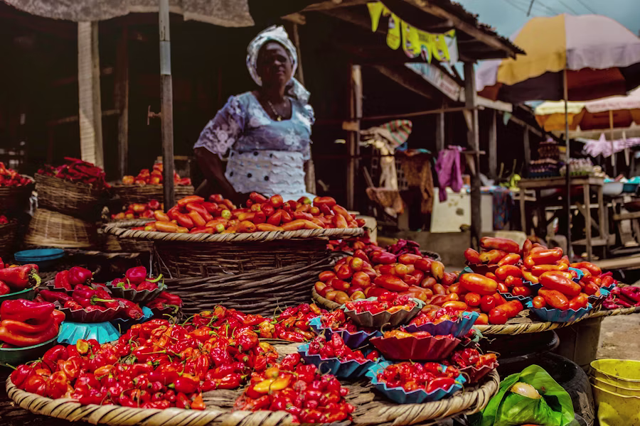 A Nigerian shop owner at their stall