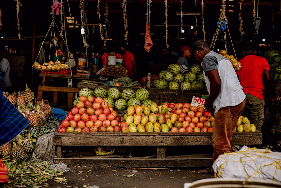 A market vendor at their stall